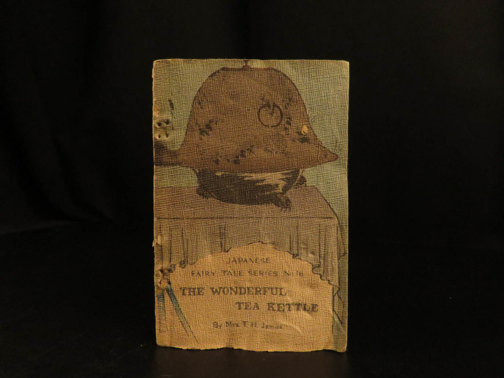 1896 1st ed japanese fairy tales wonderful tea kettle badger illustrated tokyo | <em>a rare, hand-made book on silk-stitched, creped wraps of famous japanese fairy tales! This traditional tale, ‘the wonderful tea kettle’, is an illustrated woodblock book telling the tale of an old priest and his desire to lead the chanoyu ceremony. While in meditation, his tea kettle began to shake and out of it came a badger! </em> <em> </em> <em>this volume is numbered no. 16 in a series of ‘antique japanese fairy tales’. </em>